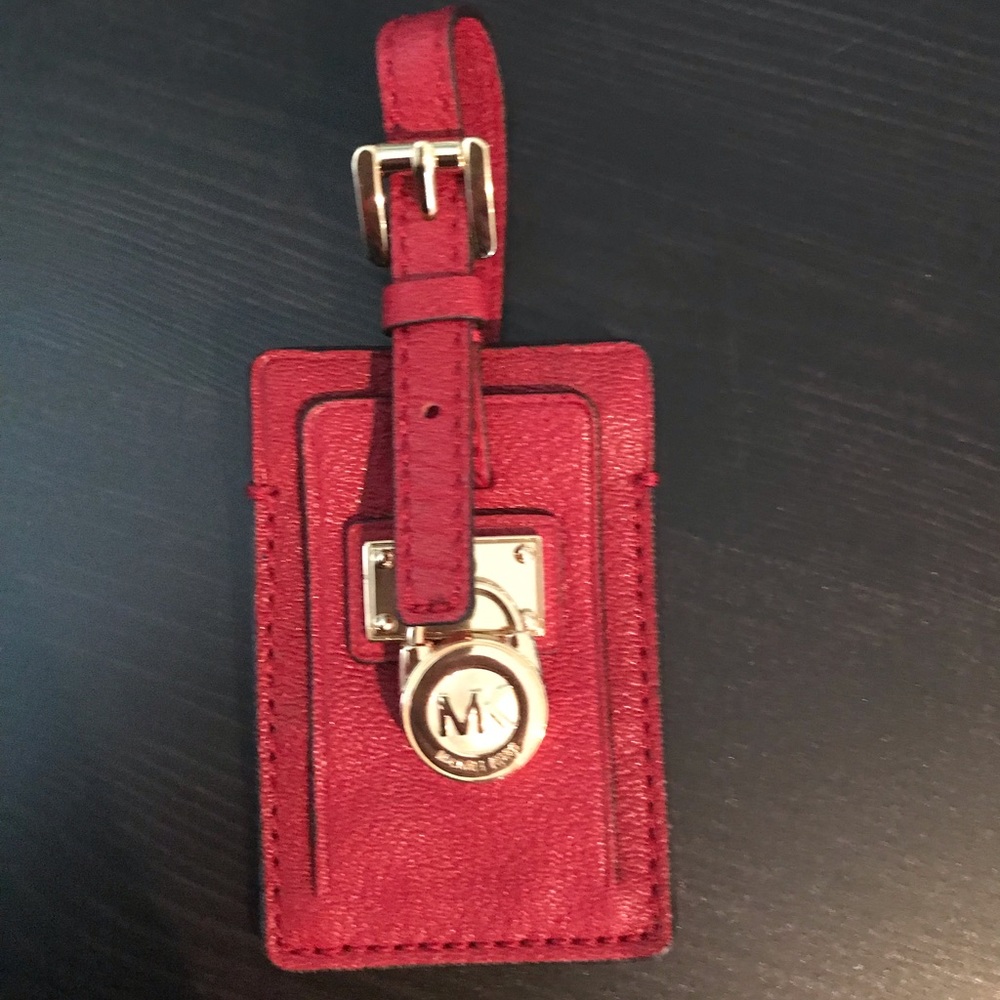 Red Michael Kors luggage tag